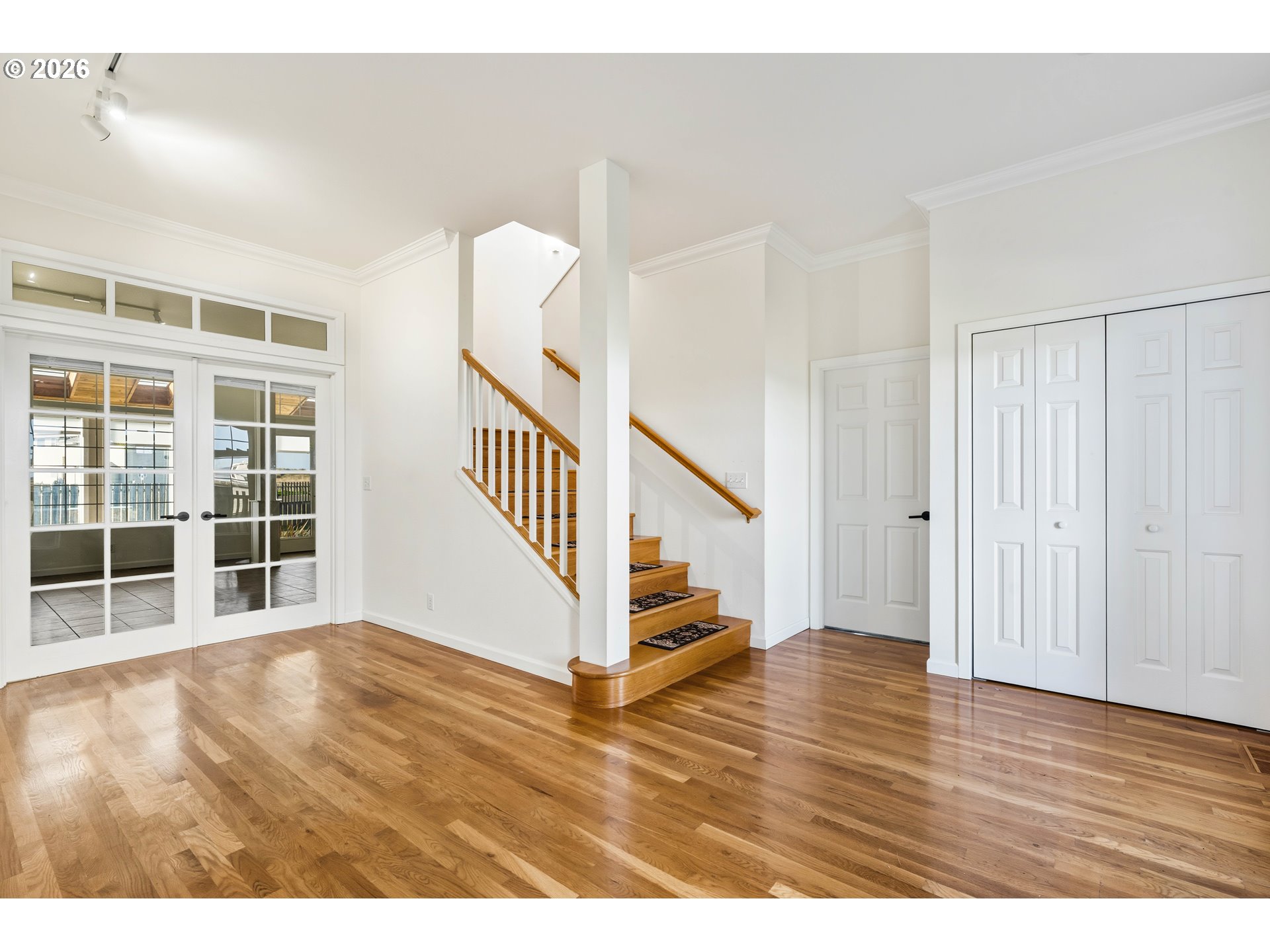 323 Madison Avenue Bandon, OR 97411 - Photo 14 of 43 a view of an entryway with wooden floor