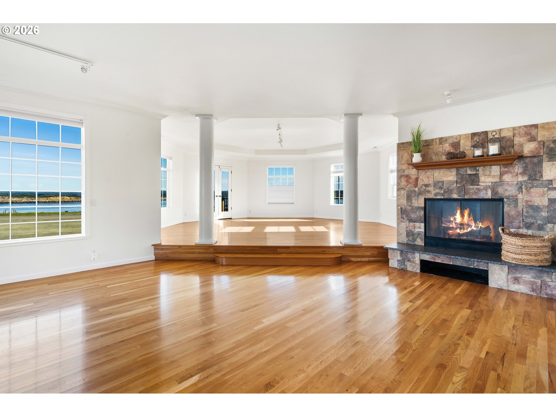 323 Madison Avenue Bandon, OR 97411 - Photo 15 of 43 a view of an empty room with fire place and a fireplace