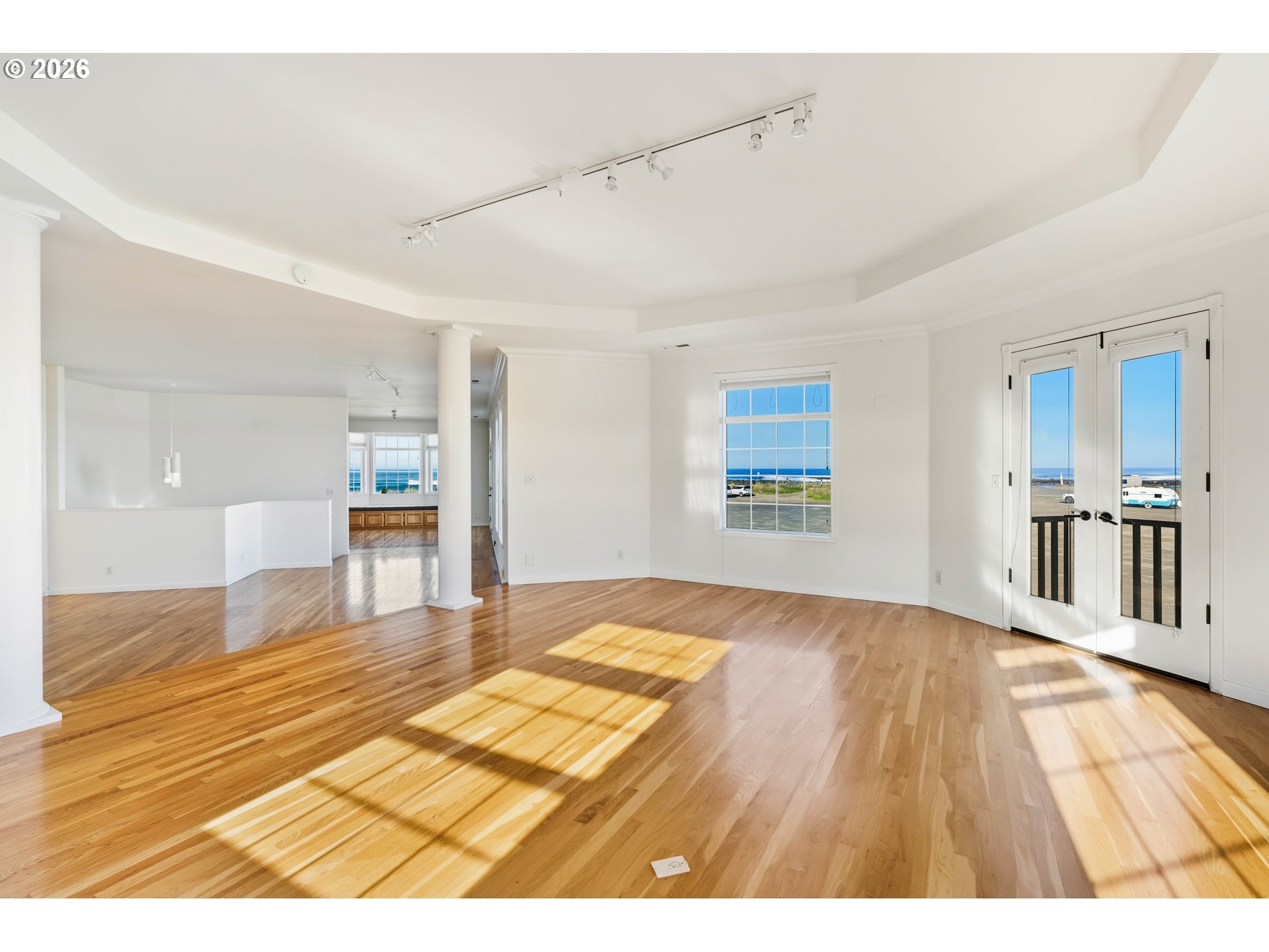 323 Madison Avenue Bandon, OR 97411 - Photo 17 of 43 a view of a room with wooden floor and kitchen view