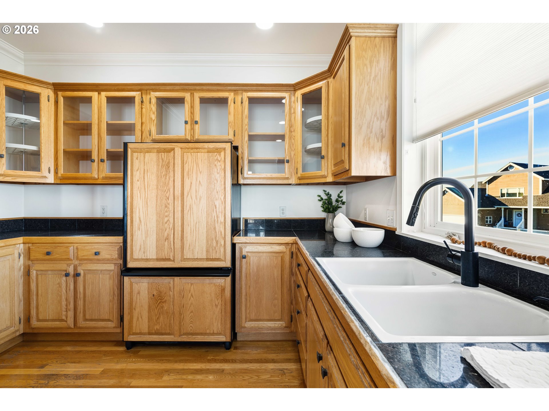 323 Madison Avenue Bandon, OR 97411 - Photo 19 of 43 a kitchen with stainless steel appliances granite countertop a refrigerator and a stove top oven