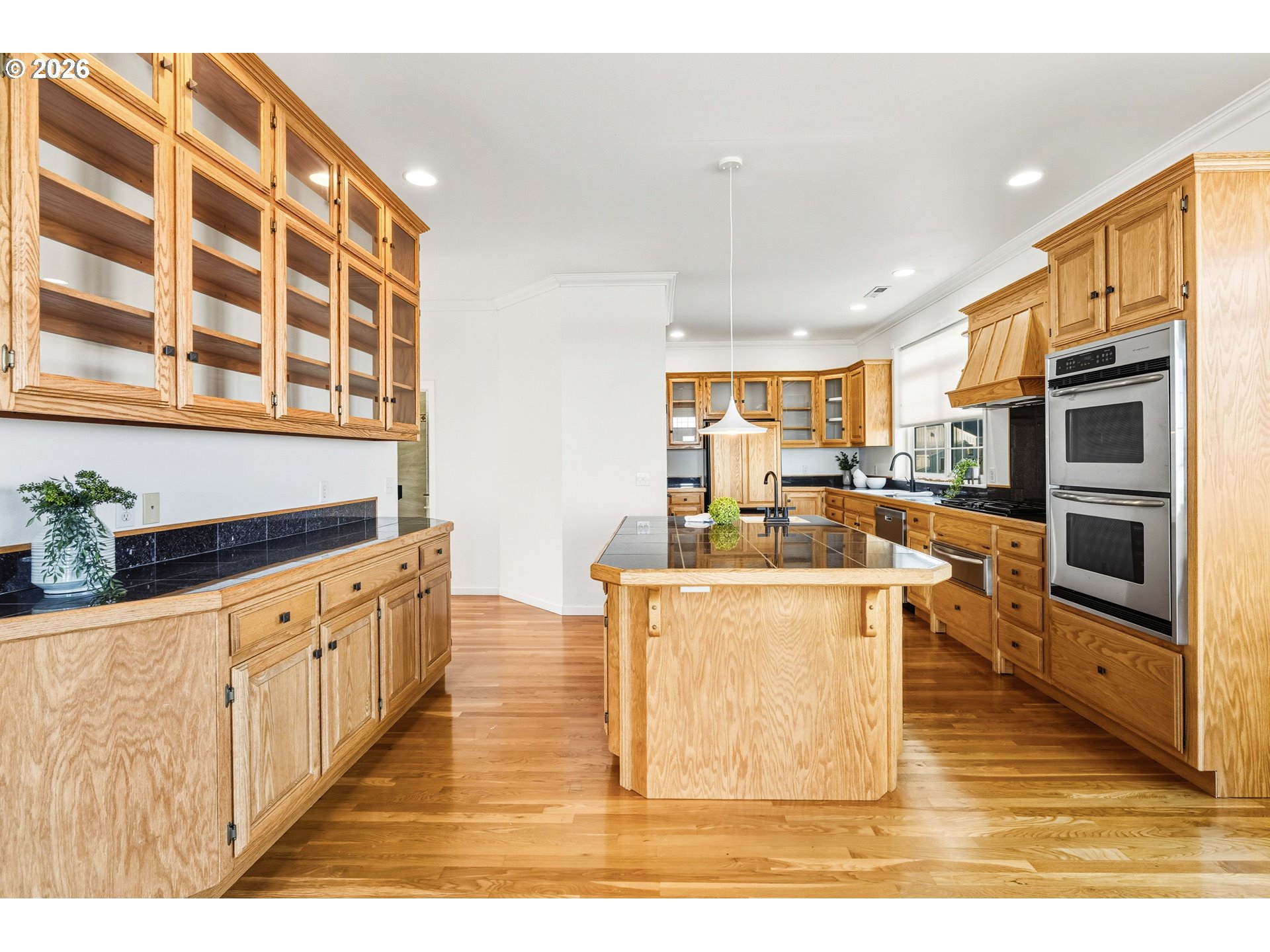 323 Madison Avenue Bandon, OR 97411 - Photo 23 of 43 a living room with stainless steel appliances kitchen island granite countertop a stove a sink and a refrigerator
