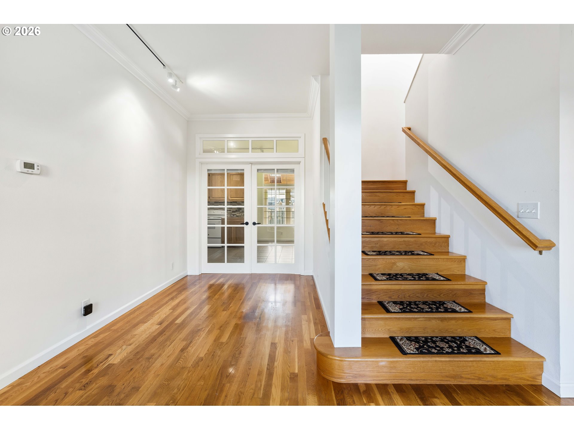 323 Madison Avenue Bandon, OR 97411 - Photo 29 of 43 a view of entryway and hall with wooden floor