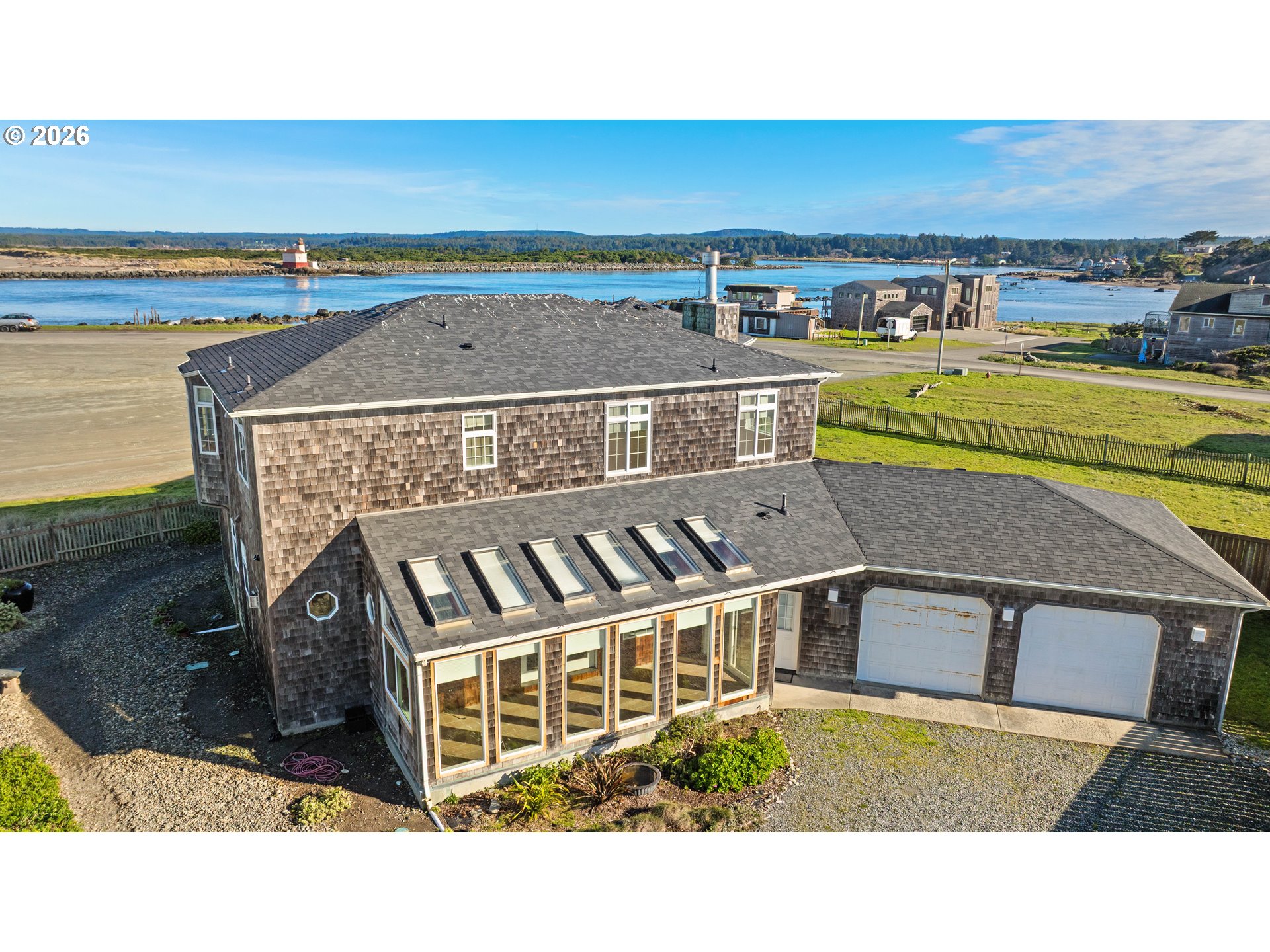323 Madison Avenue Bandon, OR 97411 - Photo 3 of 43 an aerial view of a house with a garden