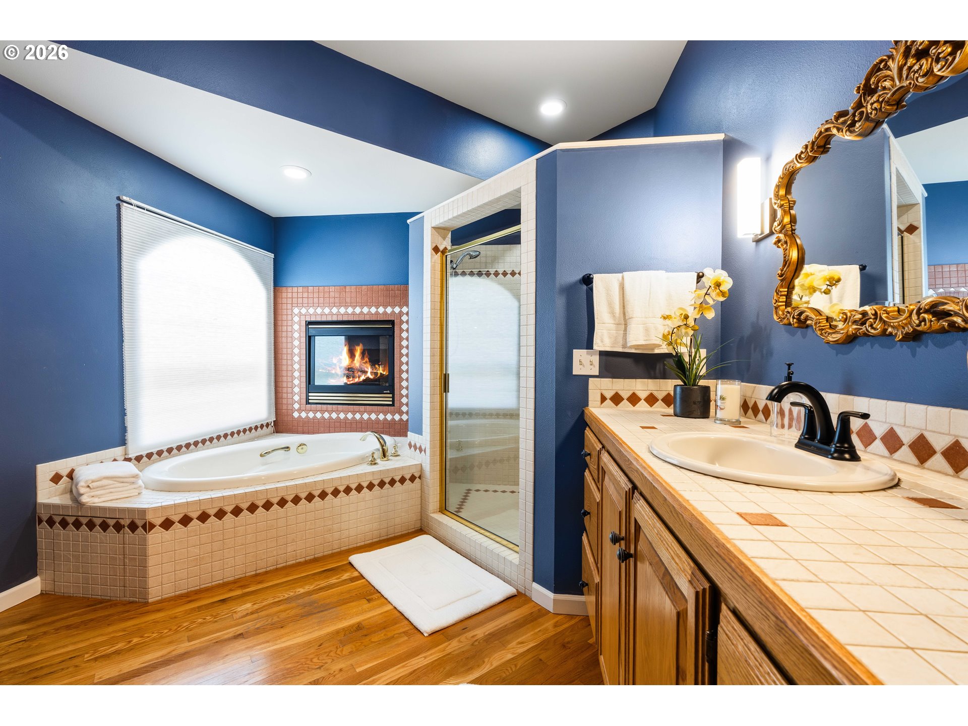 323 Madison Avenue Bandon, OR 97411 - Photo 32 of 43 a living room with a bed and dresser with mirror