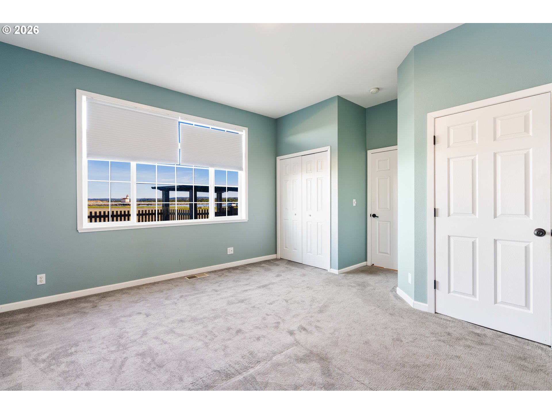 323 Madison Avenue Bandon, OR 97411 - Photo 35 of 43 a view of an empty room with a window