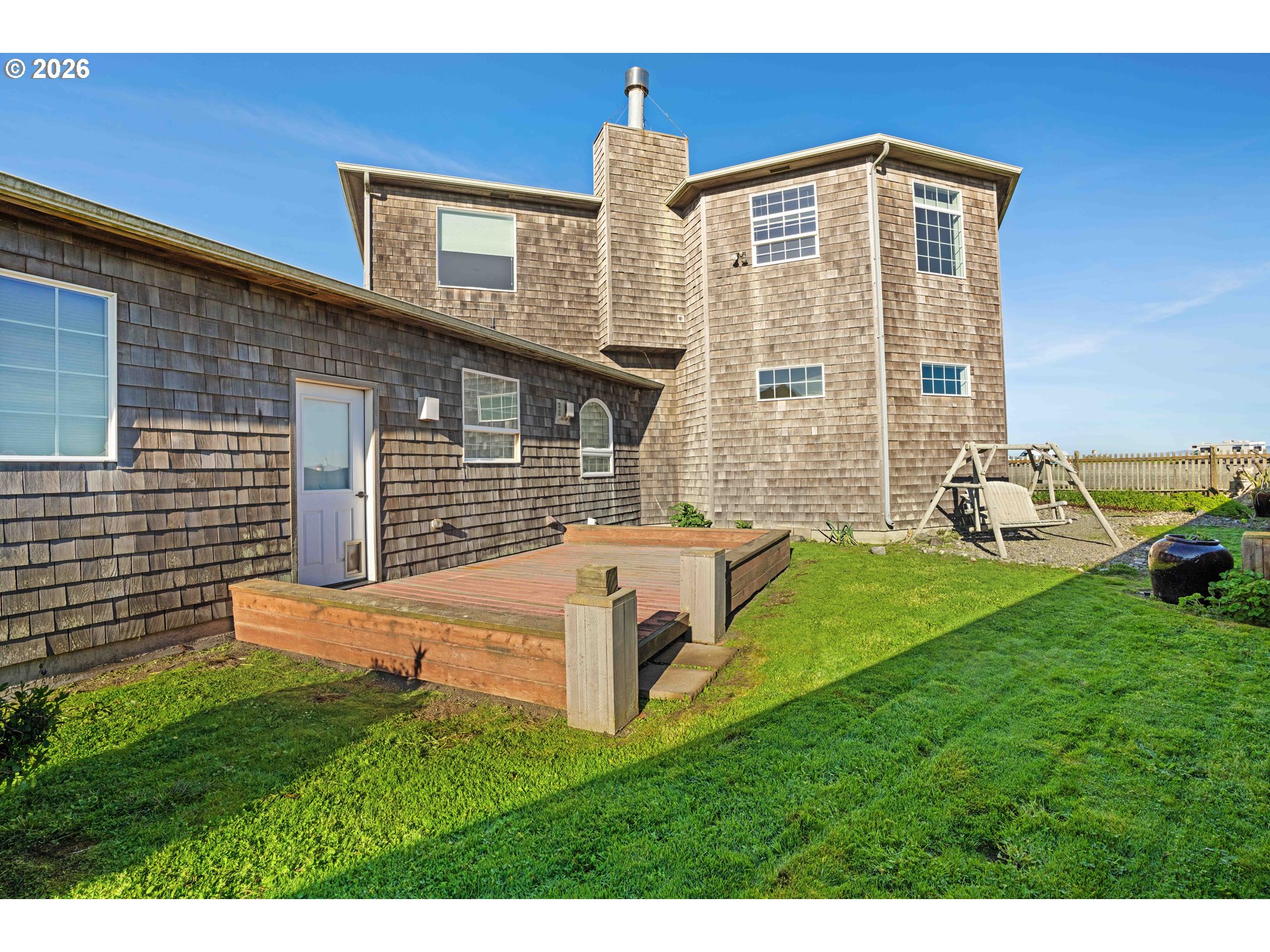 323 Madison Avenue Bandon, OR 97411 - Photo 9 of 43 a front view of a house with garden