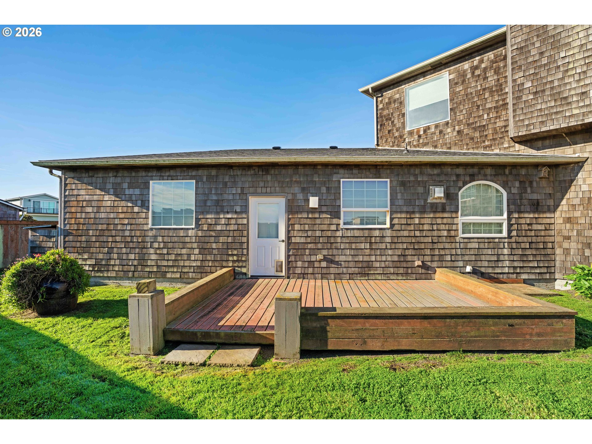 323 Madison Avenue Bandon, OR 97411 - Photo 10 of 43 a front view of a house with yard