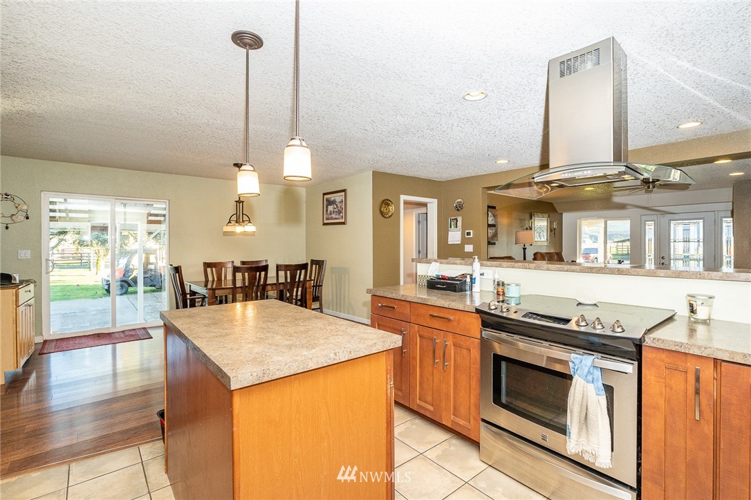 103 Mauerman Road Chehalis, WA 98532 - Photo 6 of 40 a kitchen with stainless steel appliances granite countertop a stove and more cabinets