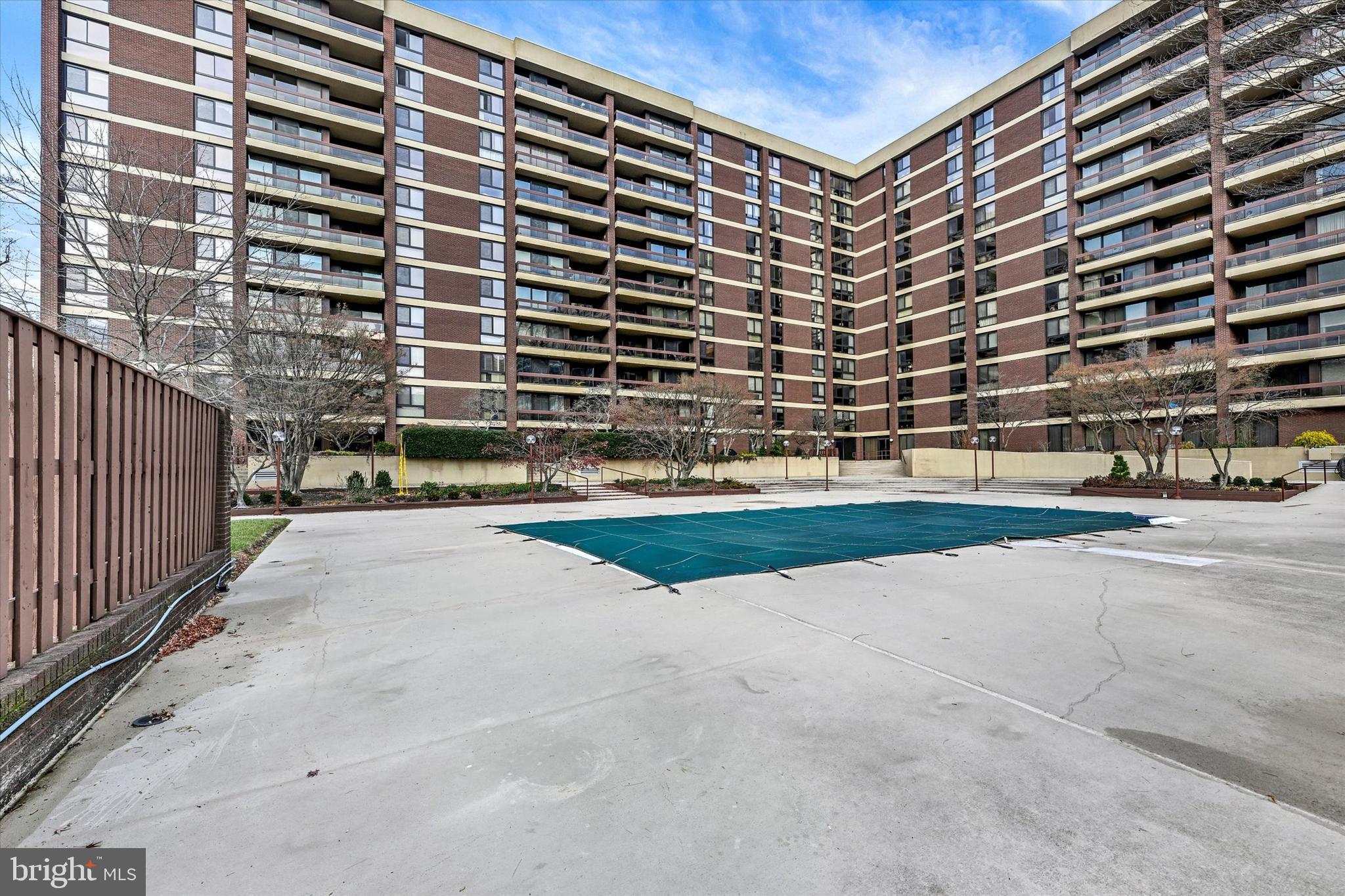 4100 North Charles Street, Unit 609 Baltimore, MD 21218 - Photo 32 of 36 a view of building with yard