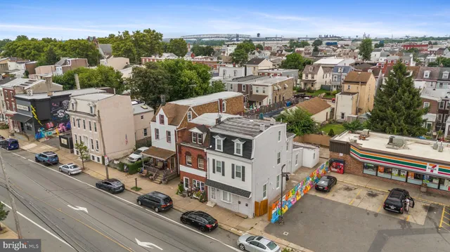 an aerial view of a building with city view
