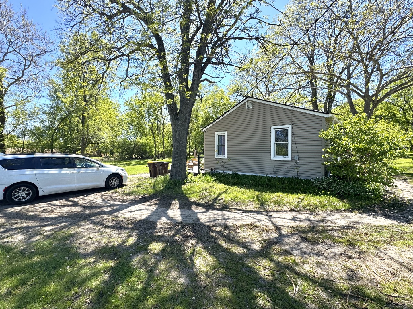 931 South Rawson Bridge Road Cary, IL 60013 - Photo 27 of 36 a view of a house with a yard