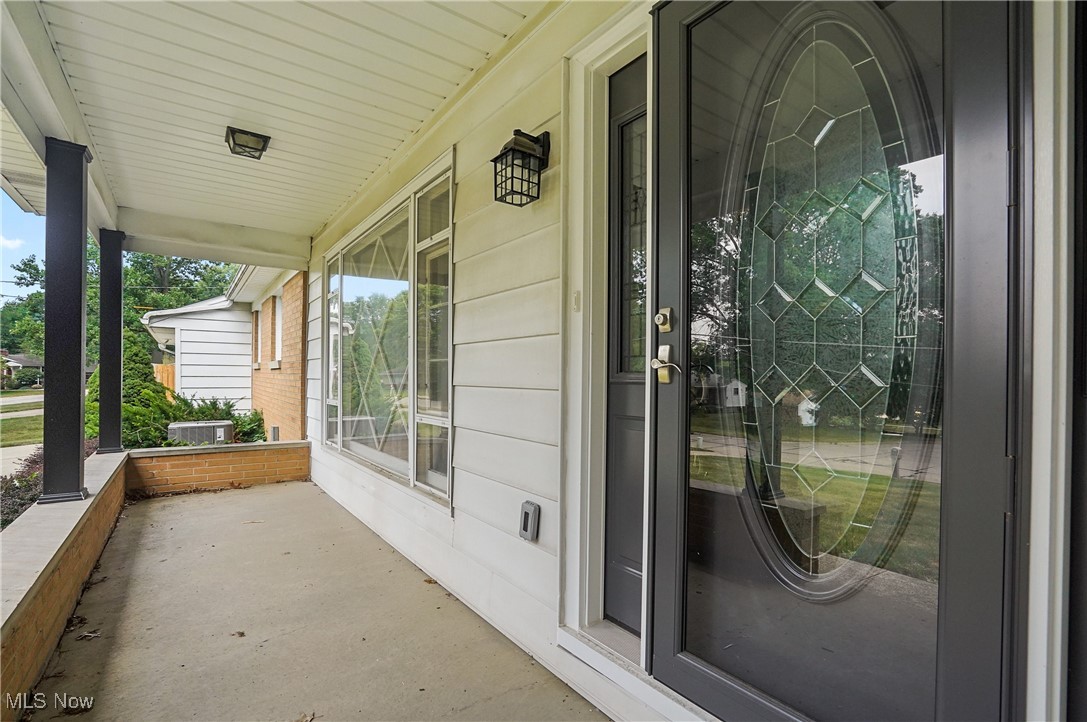 View of exterior entry featuring a porch