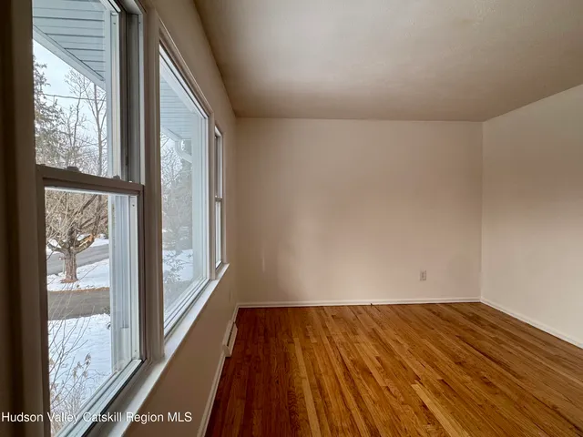 a bathroom with a toilet and a shower curtain