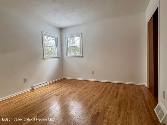a view of a livingroom with wooden floor