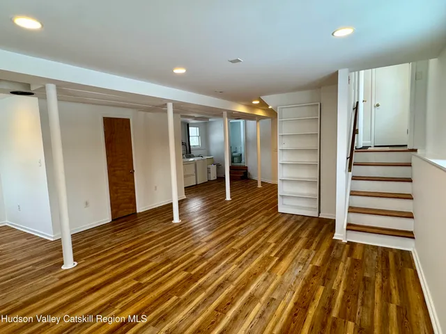 a view of hallway with wooden floor