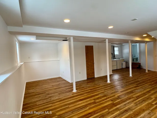 a view of an empty room with closet
