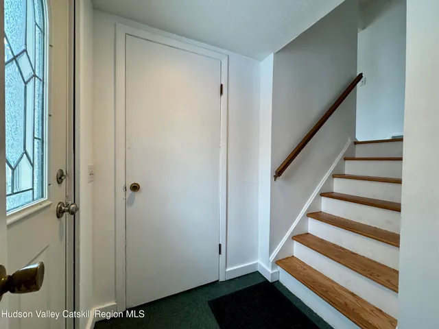a view of entryway with stairs and a window