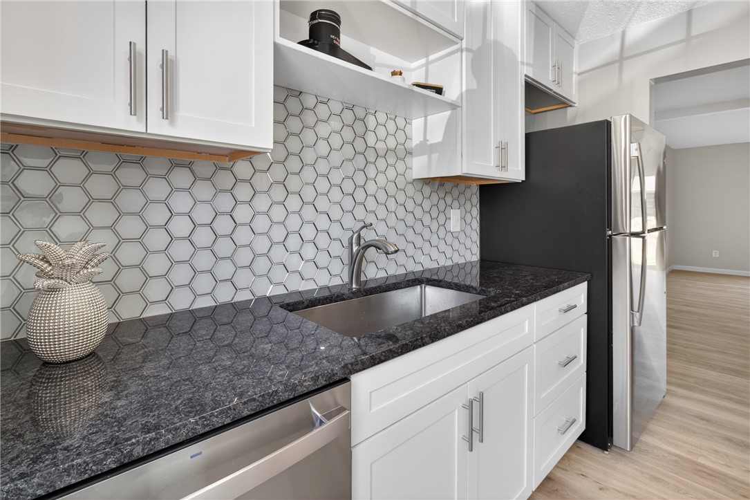 561 French Road Brighton, NY 14618 - Photo 7 of 45 KITCHEN OPEN TO THE MORE FORMAL DINING AREA