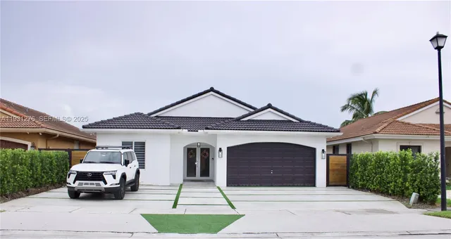 a car parked in front of a house