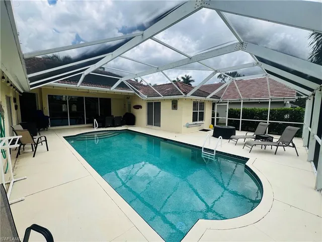 a view of a swimming pool with a patio