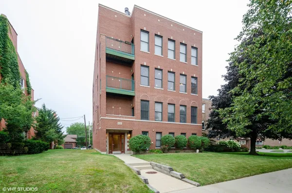 a view of building with yard