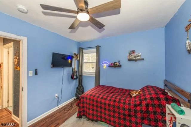 a bedroom with bed and a window