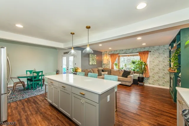 a room with a lot of counter space and a wooden floor