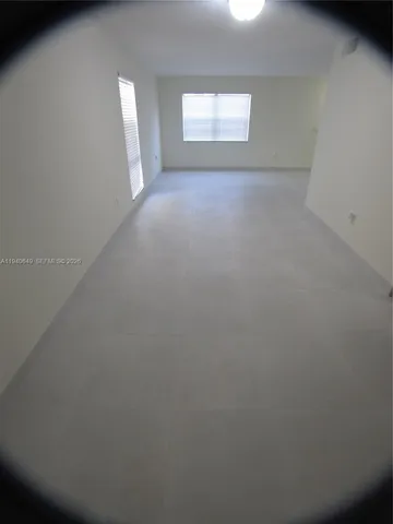 an empty room that has a window