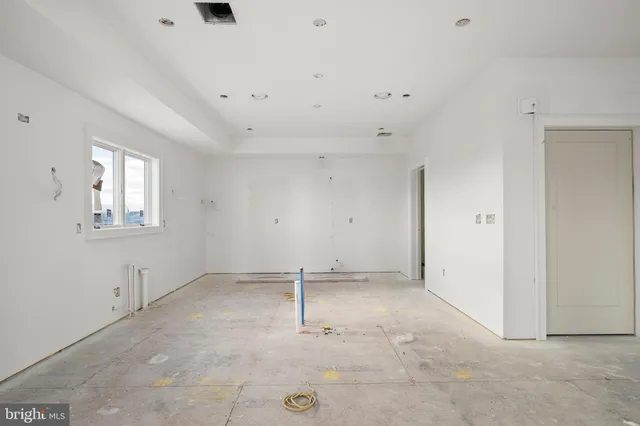 a view of an empty room with windows