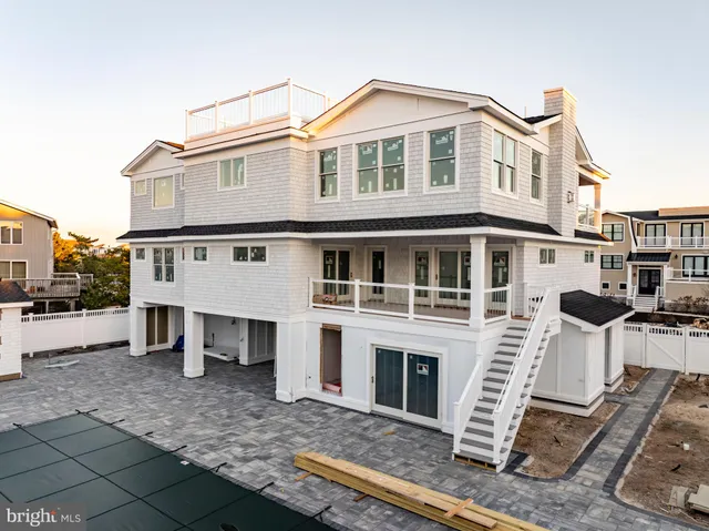 a view of a house with a yard and sitting space
