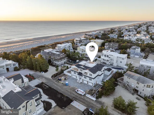 an aerial view of a residential houses with outdoor space