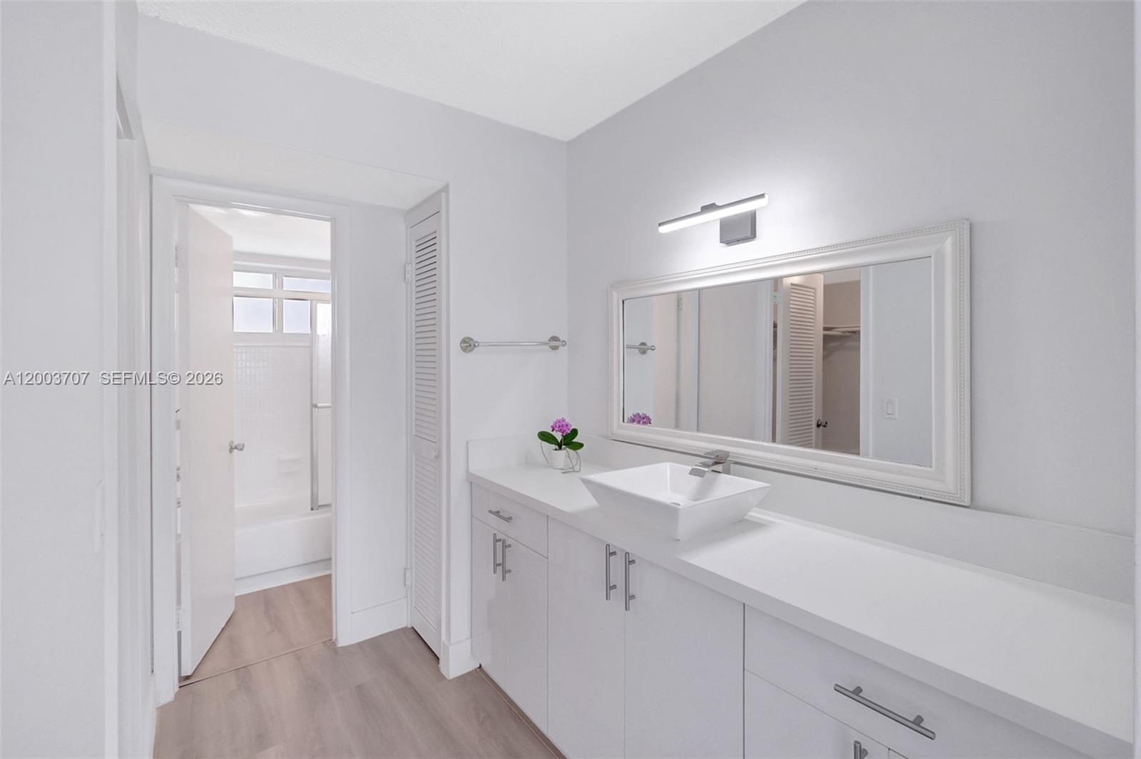 1345 Lincoln Road, Unit 501 Miami Beach, FL 33139 - Photo 20 of 33 a bathroom with a sink and a mirror
