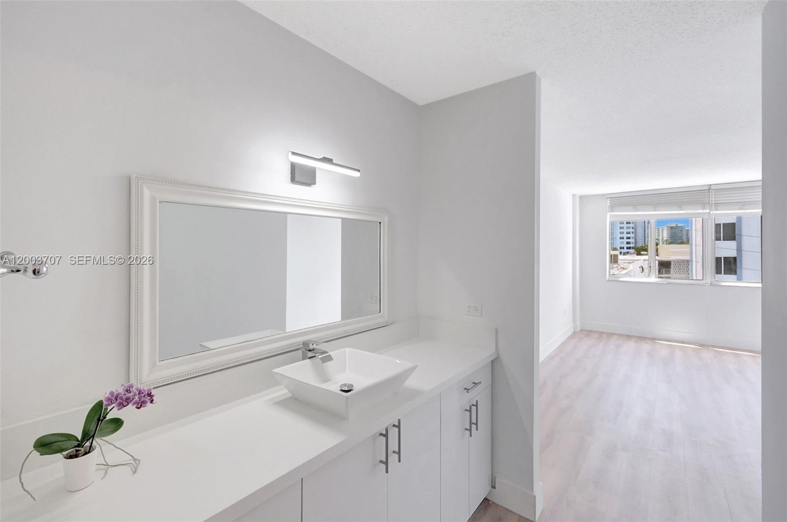 1345 Lincoln Road, Unit 501 Miami Beach, FL 33139 - Photo 21 of 33 a bathroom with a sink and a mirror
