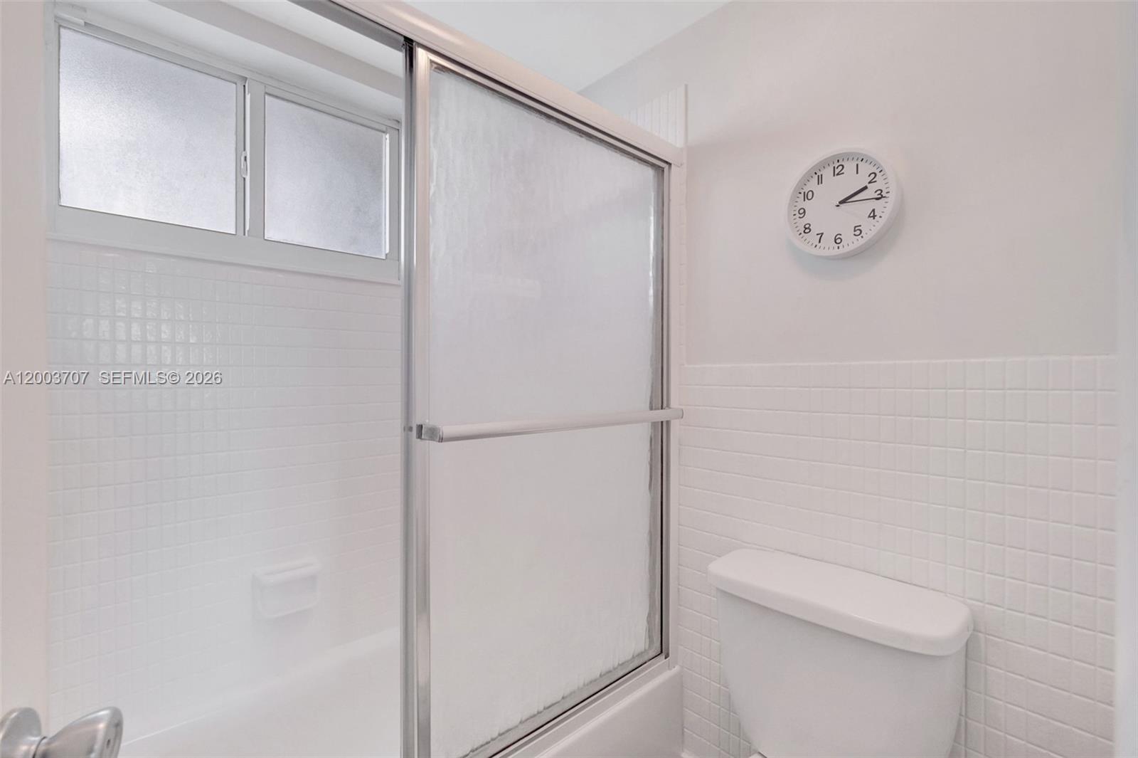 1345 Lincoln Road, Unit 501 Miami Beach, FL 33139 - Photo 22 of 33 a white toilet sitting next to a shower