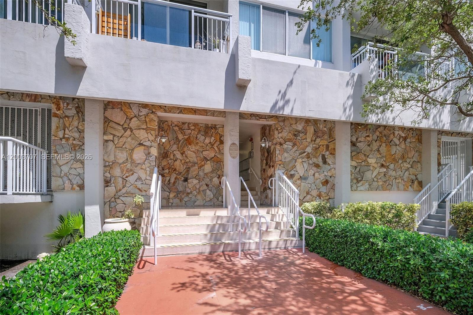 1345 Lincoln Road, Unit 501 Miami Beach, FL 33139 - Photo 4 of 33 a view of a patio with table and chairs and potted plants
