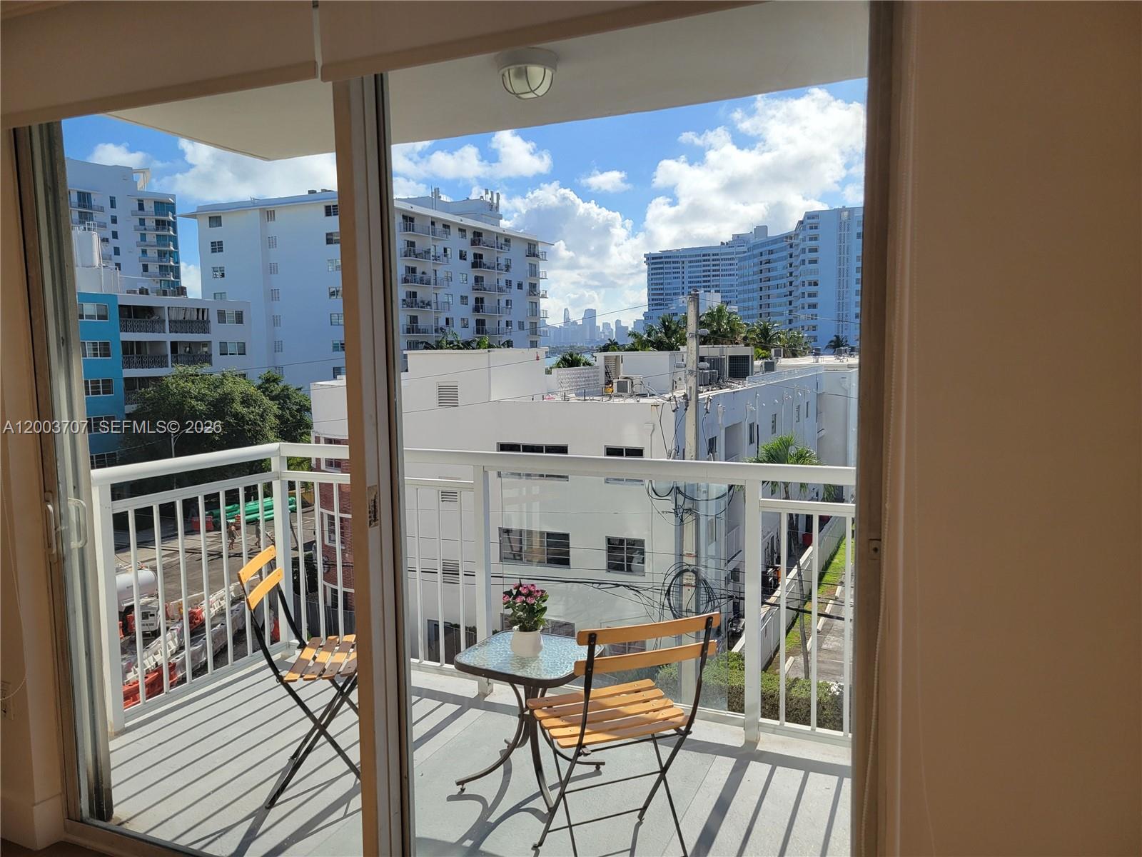 1345 Lincoln Road, Unit 501 Miami Beach, FL 33139 - Photo 8 of 33 a view of a balcony with chairs