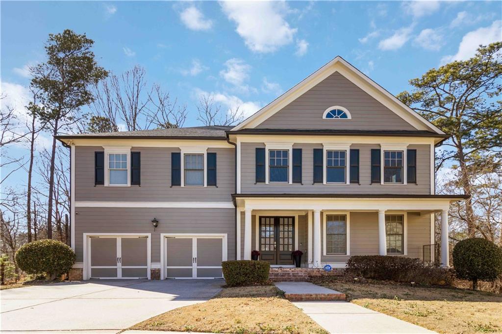 front view of a house with a yard