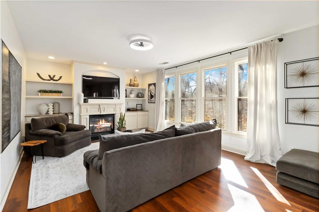 6233 Huntington Ridge Road Mableton, GA 30126 - Photo 11 of 50 a living room with fireplace furniture and a flat screen tv