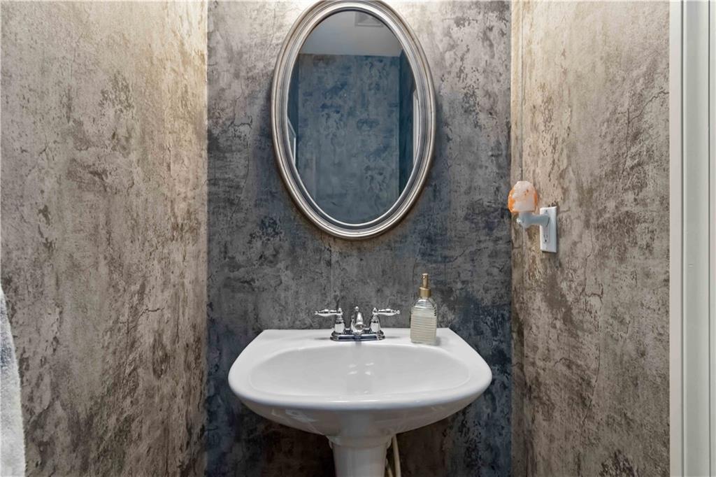 6233 Huntington Ridge Road Mableton, GA 30126 - Photo 20 of 50 a bathroom with a sink and a mirror