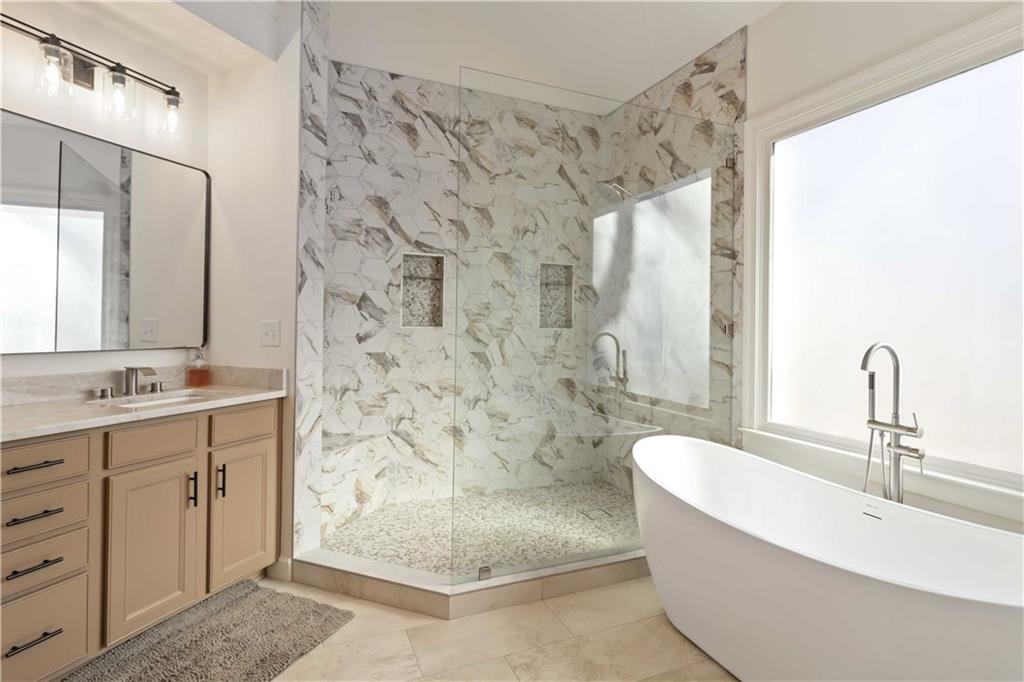 6233 Huntington Ridge Road Mableton, GA 30126 - Photo 25 of 50 a bathroom with a double vanity sink mirror and shower