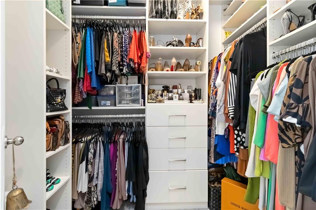 6233 Huntington Ridge Road Mableton, GA 30126 - Photo 28 of 50 a view of walk in closet with clothes and shoes