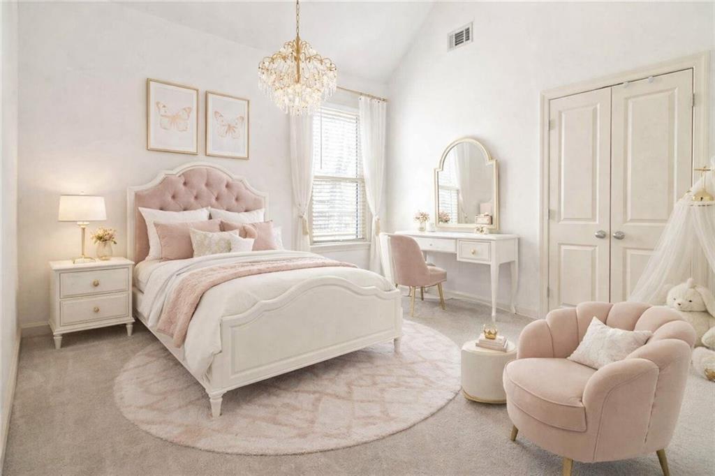 6233 Huntington Ridge Road Mableton, GA 30126 - Photo 31 of 50 a bedroom with a bed and a chandelier