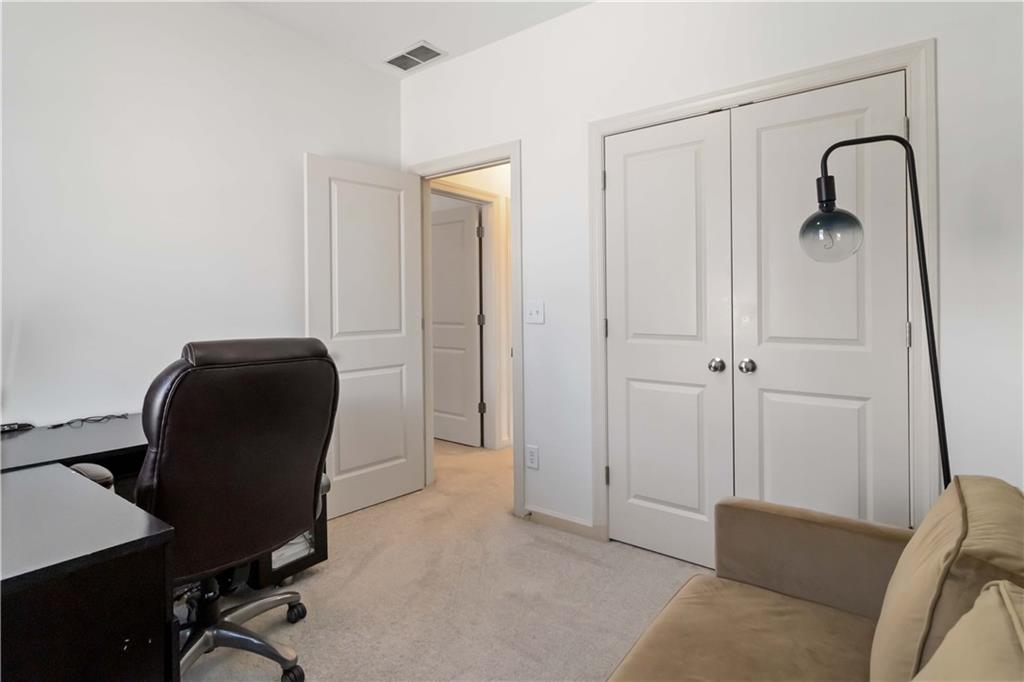 6233 Huntington Ridge Road Mableton, GA 30126 - Photo 35 of 50 a view of a workspace with furniture and a bathroom