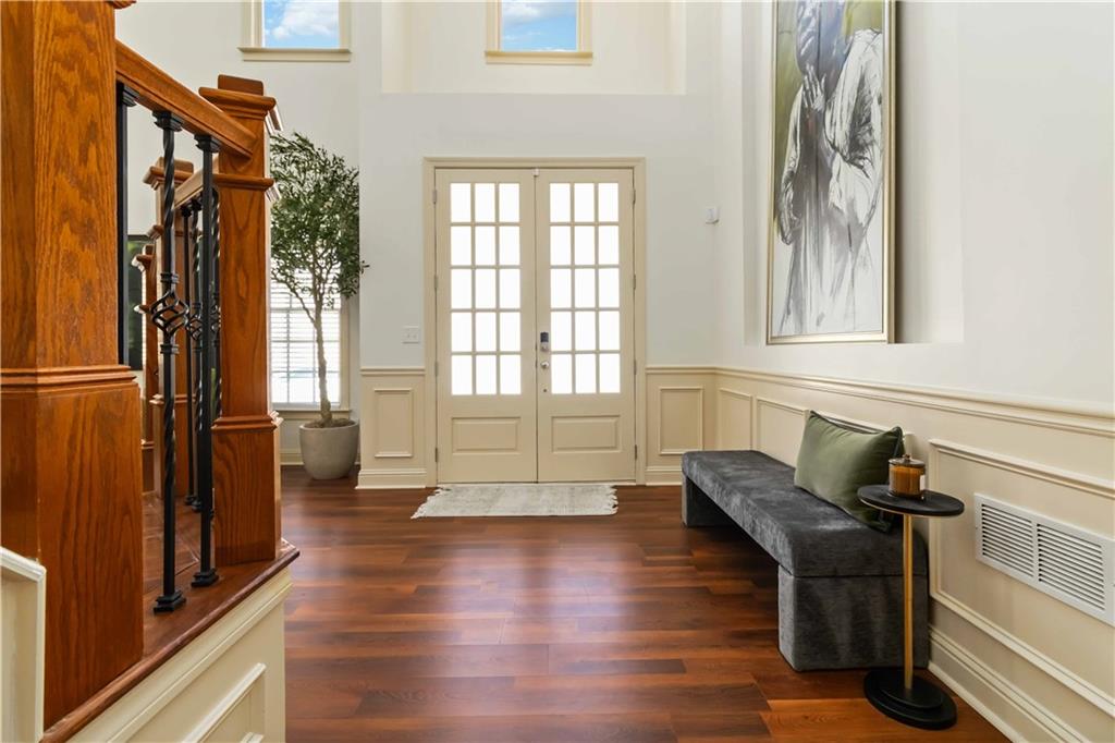 6233 Huntington Ridge Road Mableton, GA 30126 - Photo 4 of 50 a hallway with couches and wooden floor