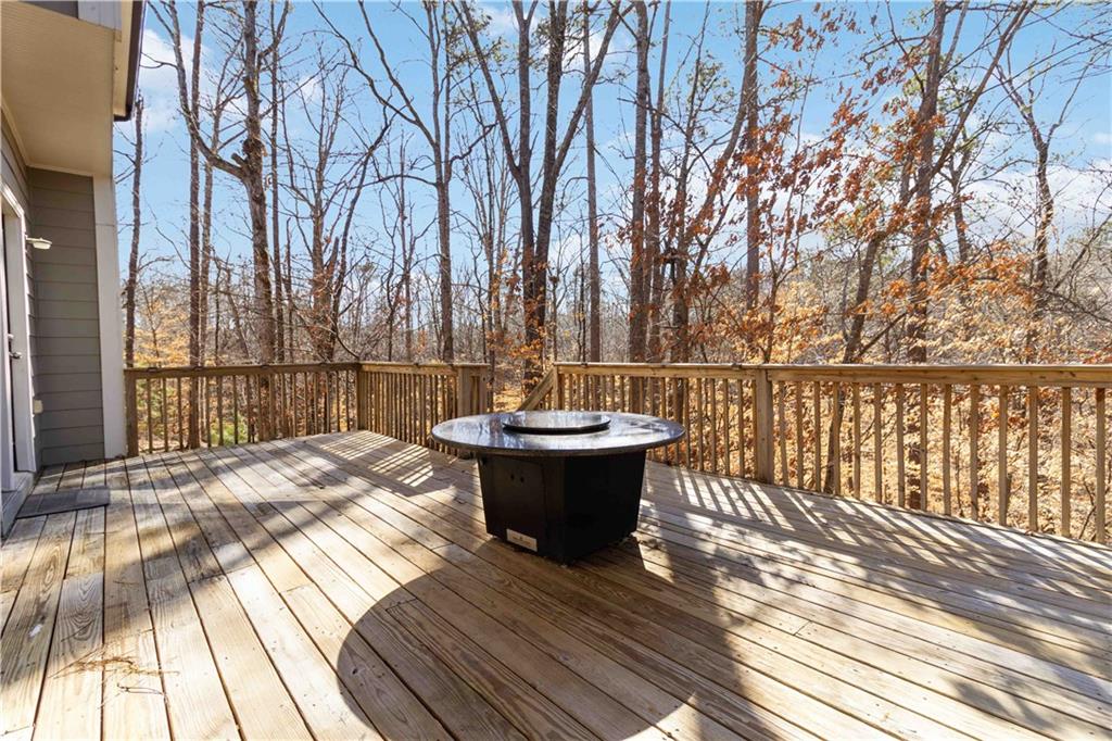 6233 Huntington Ridge Road Mableton, GA 30126 - Photo 43 of 50 a view of a roof deck with wooden floor and fence