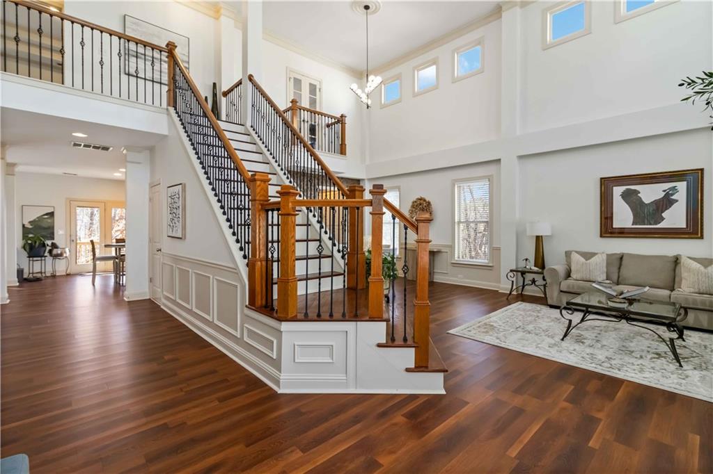 6233 Huntington Ridge Road Mableton, GA 30126 - Photo 9 of 50 a living room with fireplace furniture and a wooden floor