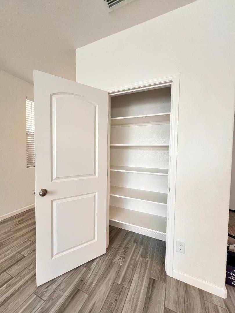 8362 Lemberger Way Sacramento, CA 95829 - Photo 11 of 28 a view of walk in closet with empty racks