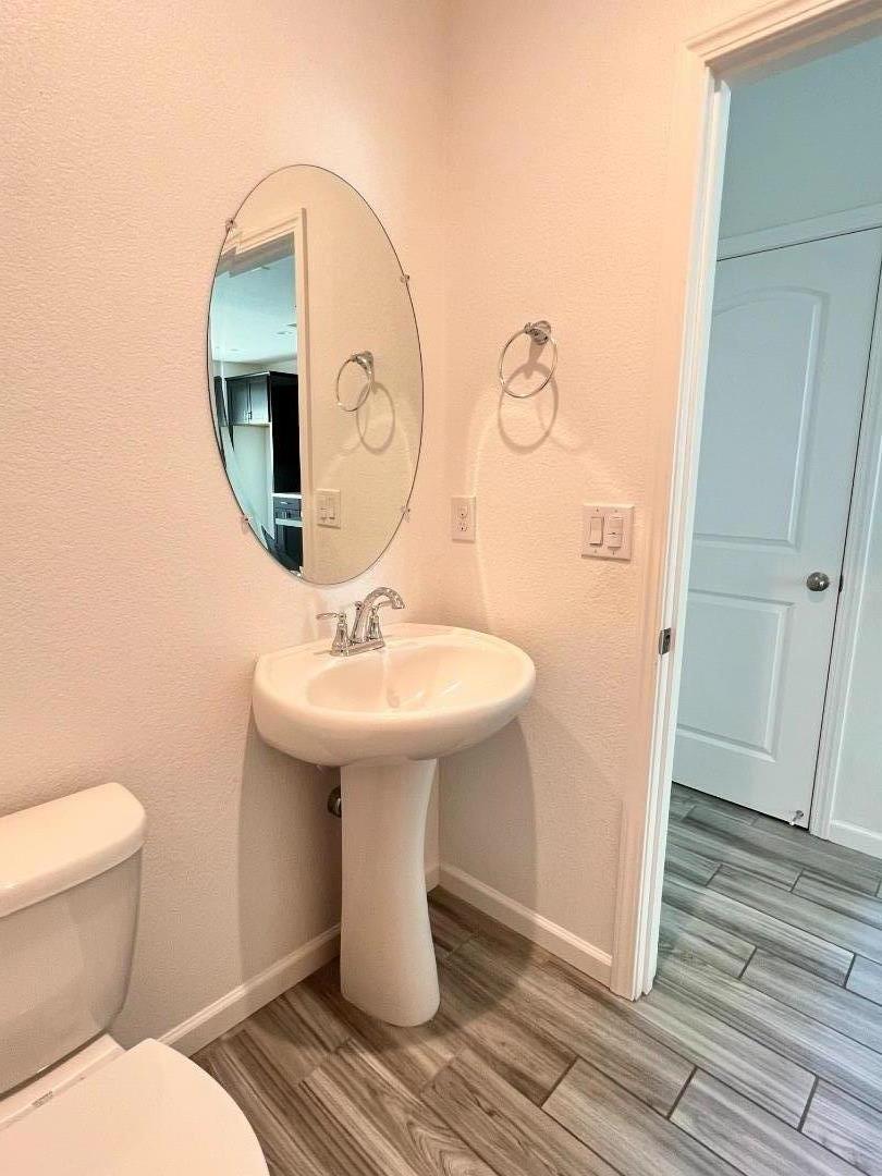 8362 Lemberger Way Sacramento, CA 95829 - Photo 12 of 28 a bathroom with a sink toilet and mirror