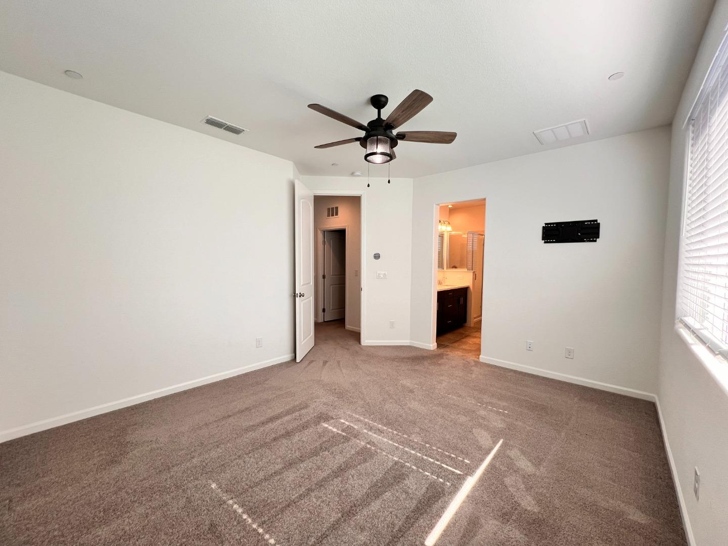 8362 Lemberger Way Sacramento, CA 95829 - Photo 13 of 28 a view of a livingroom with a ceiling fan and window