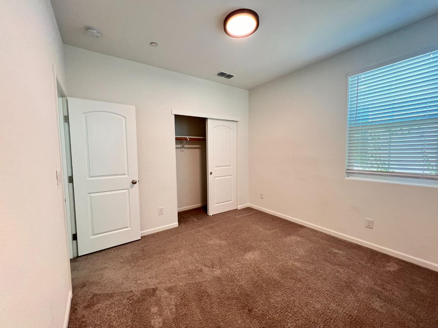 8362 Lemberger Way Sacramento, CA 95829 - Photo 15 of 28 an empty room with closet area